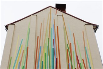 House wall painted with colourful stripes