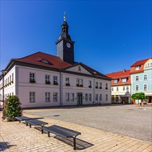 Urban scene in front of the historic town hall at the market
