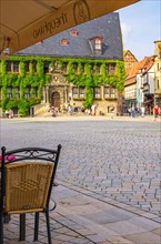 View from a street cafe across the historic market square in the old town towards the medieval town hall