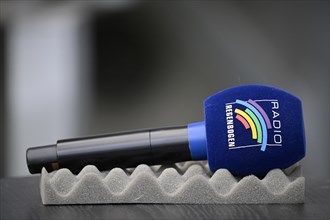 Microphone Micro with logo Radio Regenbogen lies ready on foam