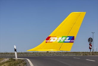 Tail fin of an aircraft in a roundabout of the DHL Air Hub