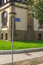 Street sign Mummental and historic house corner in the old town of the world heritage city of Quedlinburg