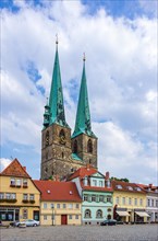 Street view of Poelkenstrasse with a view of the parish church of St. Nikolai in the historic Neustadt in the UNESCO World Heritage town
