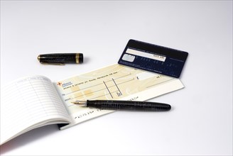 Cheque book pen and bank card