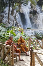 Two Buddhist monks at the Kuang Si Falls