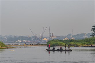 Fishermen in their dugout canoe