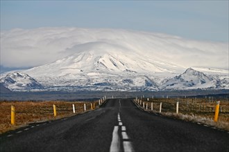 Road with view of snow-capped mountains in the south of Iceland