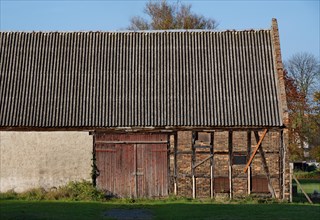 Still unrenovated historic barn in the barn district of Kremmen