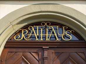 Town hall lettering above the door of the town hall of the municipality of Mittelzell next to the Minster of St. Maria and Markusl on the island of Reichenau in Lake Constance