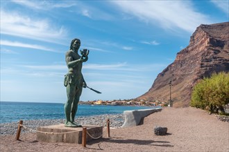 Precious statue of Hautacuperche on the beach of Valle Gran Rey village in La Gomera