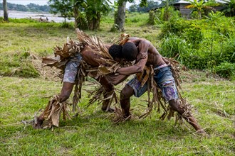 Wagenya tribal men practising wrestling