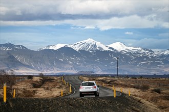 Road with view of snow-capped mountains on the Snaefellsnes peninsula in the west of Iceland
