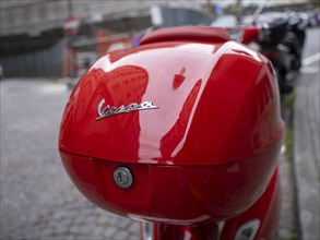 Red luggage case of a Vespa
