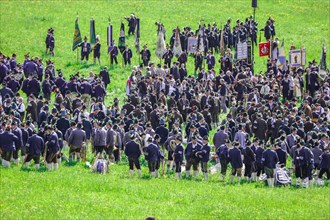 Mountain riflemen gather at the patron saint's day in a meadow near Gmund am Tegernsee