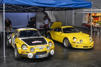 French Renault Alpine A110 racing cars in a paddock