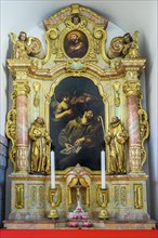 Side altar with figures of saints