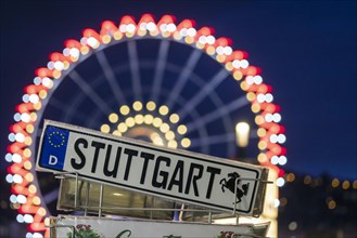 Colourfully illuminated Ferris wheel at Schlossplatz