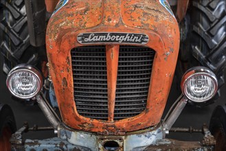Close-up of an old Lamborghini tractor with brand emblem