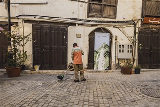 A man sweeps in the old city of Jeddah
