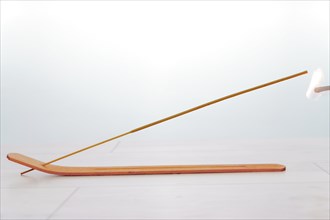 Close-up of an incense stick isolated on a white background