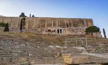 View of Acropolis walls and hill slopes and theater of Dionysus in Athens