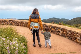 Mother and son walking and looking at the views from the top of Garajonay in La Gomera