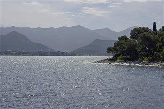 Coastal landscape with mountains in the background near Saint Florent