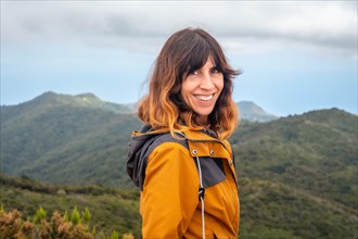 Woman smiling after finishing trekking on top of Garajonay in La Gomera