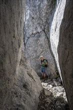 Climbers in a narrow rock passage