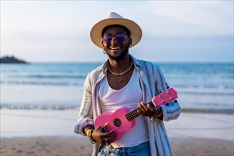 Portrait of black ethnic man enjoy summer vacation on the beach playing ukulele