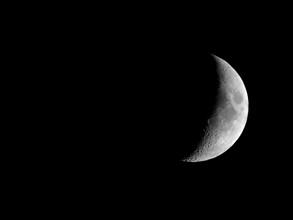 Waxing crescent moon seen with telescope