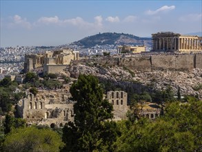 Panoramic view of Athens and Acropolis shot from Hill of Muses at clear summer day
