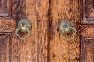 Old Handmade ottoman door knob on wood