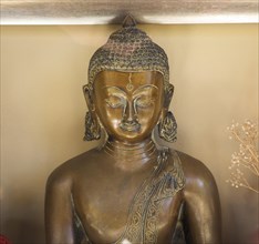 Bronze statue of seated Buddha