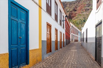 Colored doors and windows to the streets in the village of Agulo in the north of La Gomera in summer