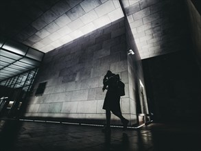 Silhouette of person on night city street