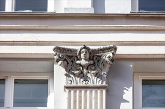 Facade detail face on a capital