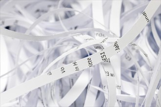 Paper strip documents made unrecognisable in the shredder