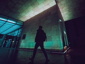 Silhouette of the man on night city street