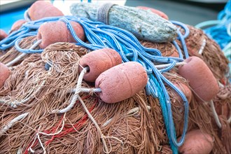 Fishing nets and buoys in the harbour of Port de Centuri