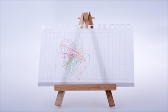 Sheet of white paper put on tripod for painting on white background