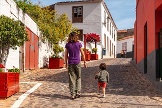 Mother and son visiting the village of Agulo in the north of La Gomera on vacation