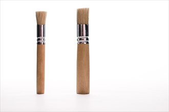 Close-up of two brushes on isolated on white background
