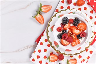 Healthy berry yogurt bowl with strawberry