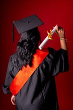 Female student in a graduation photo. End of education degree with graduate diploma. University