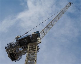 Construction crane in building site