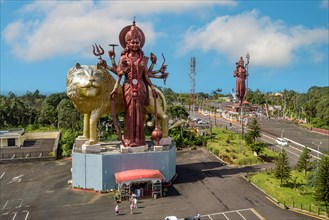 Aerial view Bird's eye view of left Hindu large sculpture statue large sculpture of Goddess Durga Mata with lion