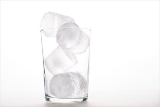 Close-up of an empty glass with ice isolated on a white background