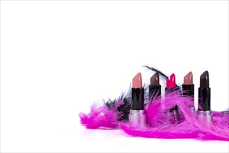 Open lipsticks with feathers