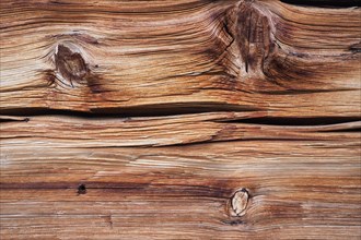 Weathered wooden beam of an alpine hut as natural background
